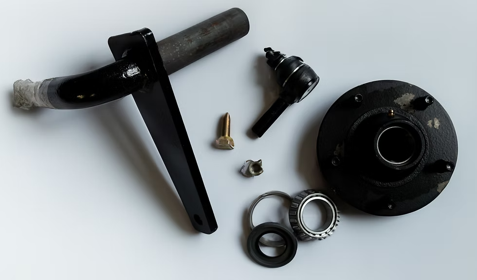 Kory running gear replacement parts including a spindle, tie rod end, hub, and bearings